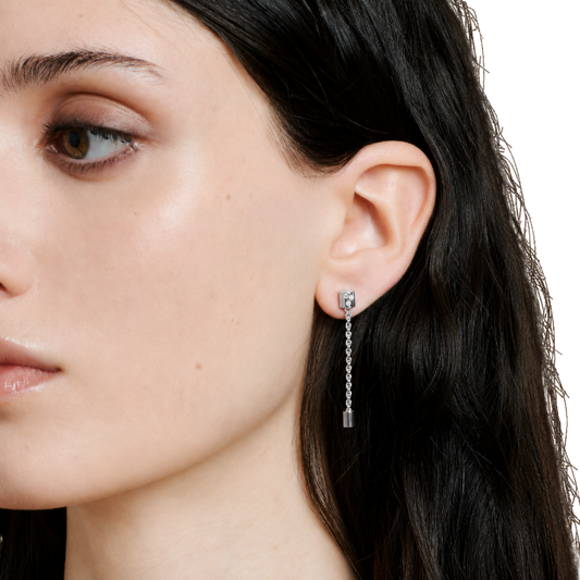 Featuring a drop design, they feel light and fluid in movement, with a soft sparkle from diamonds.