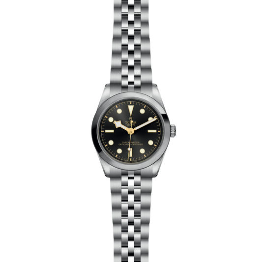 Silver watch with black dial on a white background