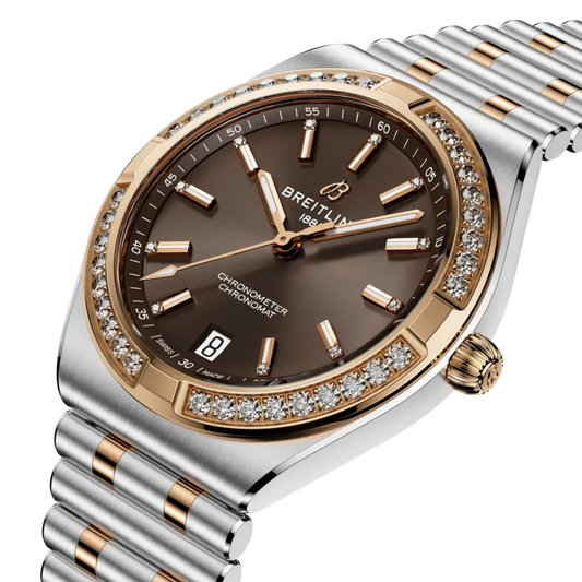 Angled view of the Breitling Chronomat highlighting its brown dial and diamond-set bezel.