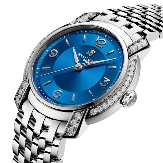 side view of Breitling diamond set stainless steel watch case crown and gem set bezel detail