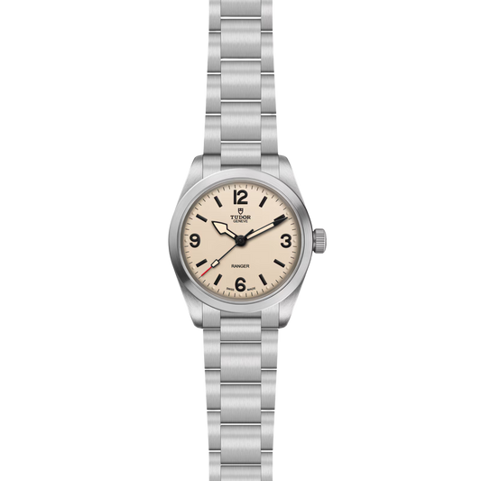 Full view of the Tudor Ranger watch with a brushed stainless steel bracelet and cream dial.