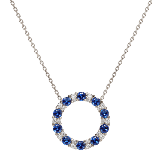 18ct white gold sapphire and diamond circle pendant necklace featuring alternating blue sapphires and brilliant cut diamonds in a large circular design