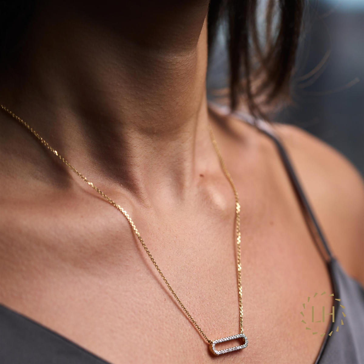 A Model Wearing The Small Link Pendant with Diamonds in 18ct Yellow Gold