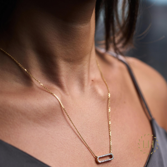 A Model Wearing The Small Link Pendant with Diamonds in 18ct Yellow Gold