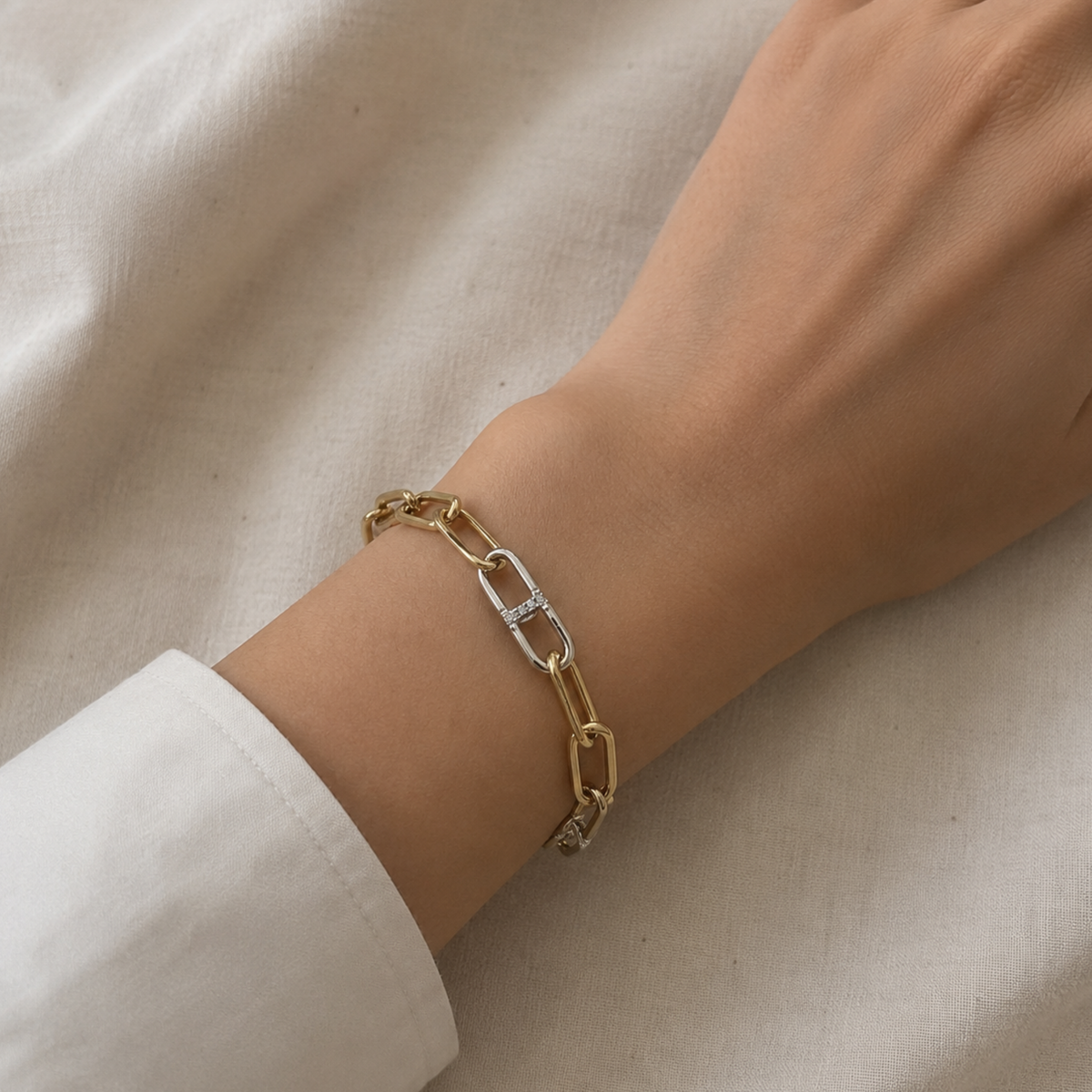 Discover the 19cm Diamond Link Bracelet in 18ct yellow and white gold, featuring 0.16ct on a modals wrist.