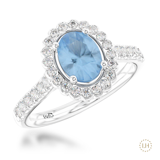 Platinum Oval Cut Aquamarine & Diamond Cluster Ring, featuring a 3.58ct aquamarine surrounded by 0.50ct of sparkling diamonds.