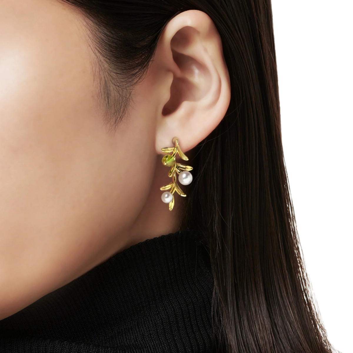 Inspired by the graceful beauty of nature, these Mikimoto Olive Akoya Pearl and Peridot Drop Earrings capture the delicate movement and elegance of shimmering olive leaves.