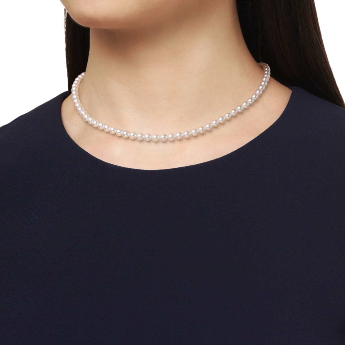 Mikimoto M Code Necklace, featuring luminous 5mm Akoya cultured pearls with a distinctive 18ct yellow gold chain clasp on a modal 