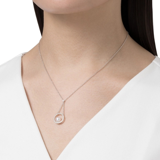 A model wearing Mikimoto Circle Collection 7mm Akoya Cultured Pearl and Diamond Pendant in 18ct White Gold
