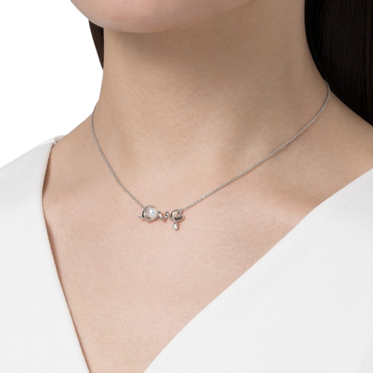 A model wearing Mikimoto Love 5.75mm Akoya Cultured Pearl and Diamond Pendant in 18ct White Gold