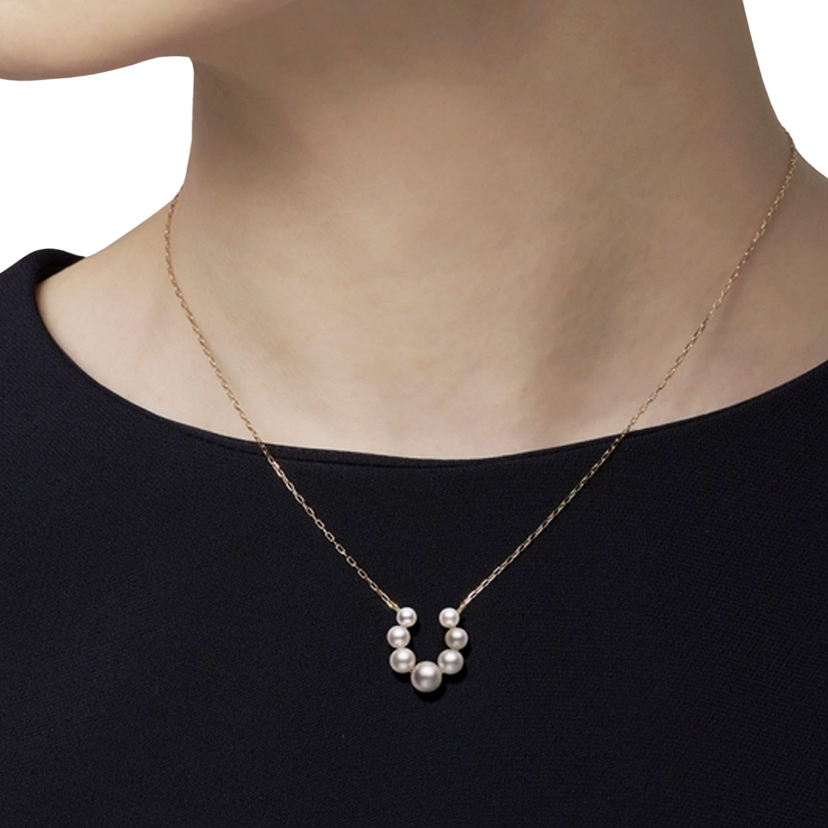 A model wearing Mikimoto Bubble Akoya Cultured Pearl and Diamond Pendant in 18ct Yellow Gold