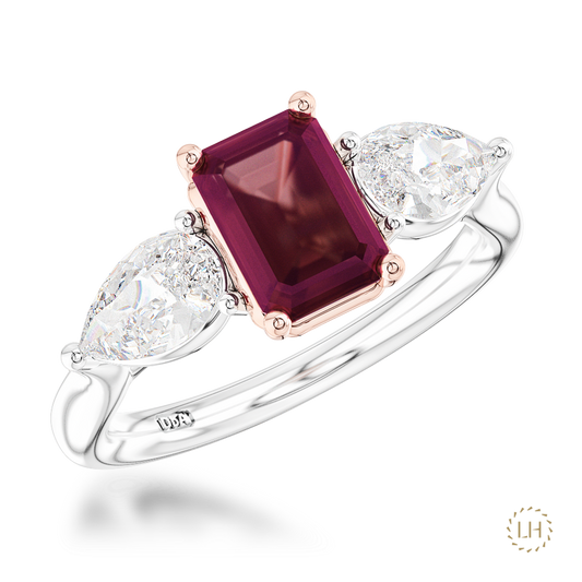 Platinum Emerald Cut Diamond Three Stone Ring, featuring a 1.51ct emerald-cut centre diamond complemented by two pear-shaped diamonds totalling 0.80ct.