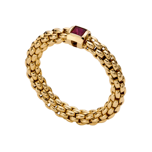 A vibrant ruby sits at the centre of this medium FOPE Souls ring, crafted in polished 18ct yellow gold with the collection's signature flexible design.