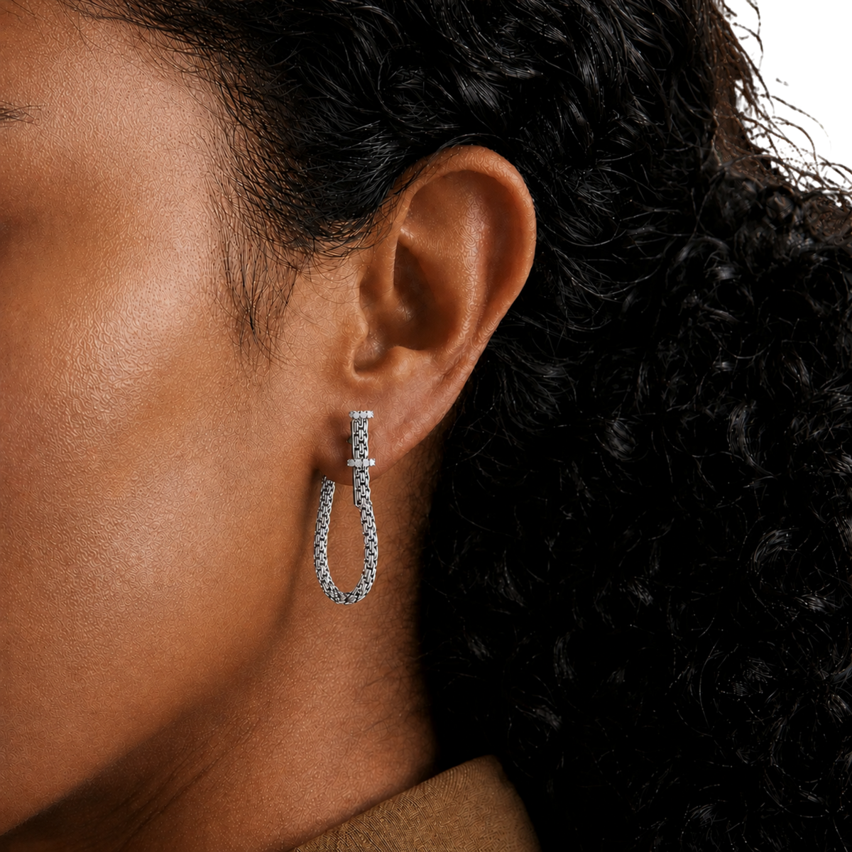 Their larger hoop silhouette creates an elegant yet modern statement while remaining lightweight and comfortable for everyday wear.