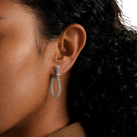 Their larger hoop silhouette creates an elegant yet modern statement while remaining lightweight and comfortable for everyday wear.