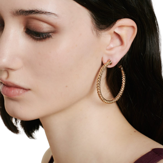 The FOPE Essentials Large Hoop Earrings are expertly crafted in 18ct rose gold, bringing together timeless style and contemporary Italian design. Their 50mm profile creates an elegant statement while remaining lightweight and comfortable for everyday wear.