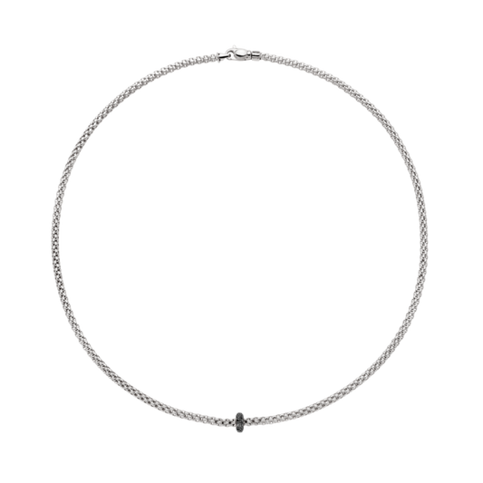 Designed in Italy, this FOPE necklace combines flexible 18ct gold craftsmanship with a striking 0.20ct black diamond detail. The minimalist design makes it effortlessly versatile, perfect for everyday elegance or elevated styling.