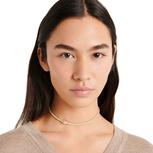  A single 0.01ct diamond adds a subtle touch of sparkle to its signature flexible design.
