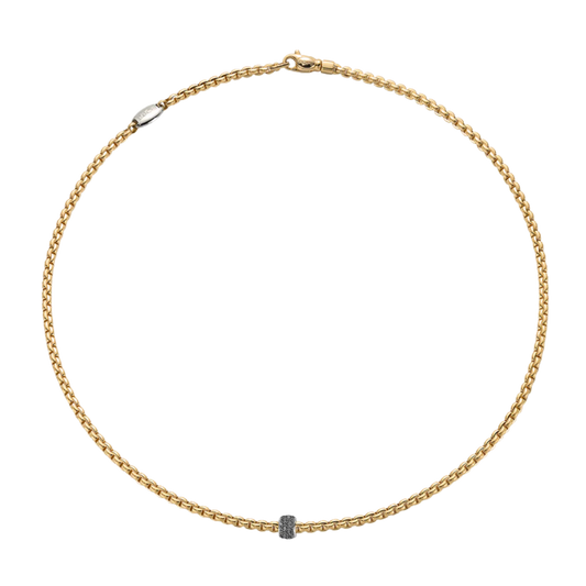 Bold and beautifully refined, this FOPE Eka Flex'it necklace is crafted in 18ct yellow gold and finished with a striking 0.20ct black diamond pavé rondel. 