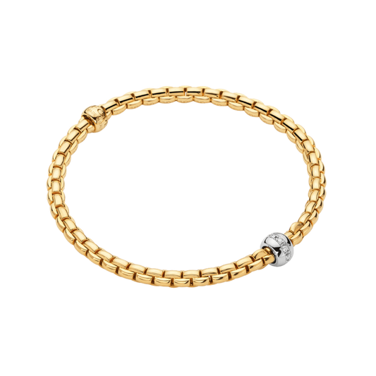 A striking contrast of yellow and white gold gives this large FOPE Eka Tiny bracelet its distinctive look, finished with a 0.07ct diamond-set rondel for added sparkle.