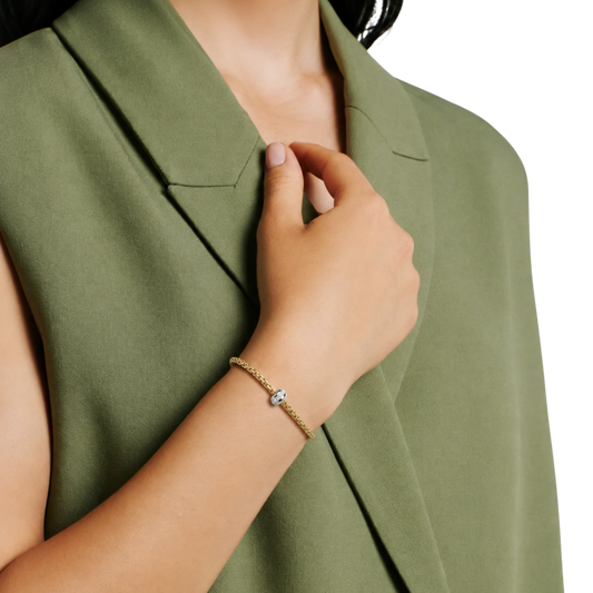 18ct yellow gold FOPE bracelet with white gold diamond rondel on model.