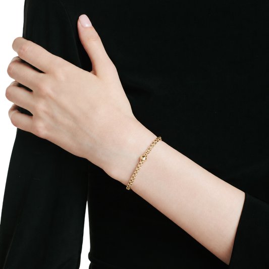 FOPE 18Ct EKA yellow gold bracelet with diamond rondel on model. 