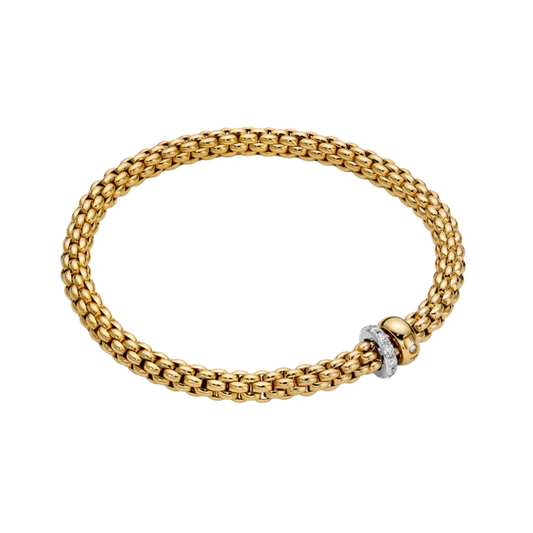 Warm 18ct yellow gold is paired with a sparkling white gold diamond rondel in this large FOPE Solo Flex'it bracelet, designed for effortless everyday comfort.