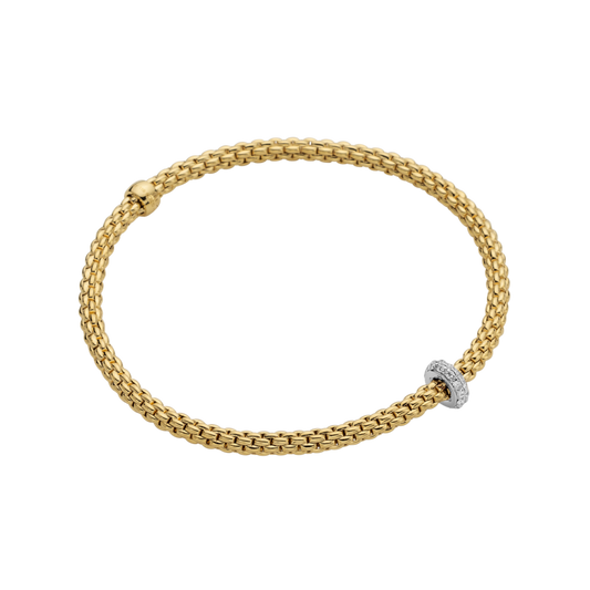 A sparkling white gold rondel set with diamonds with 18ct yellow gold bracelet.