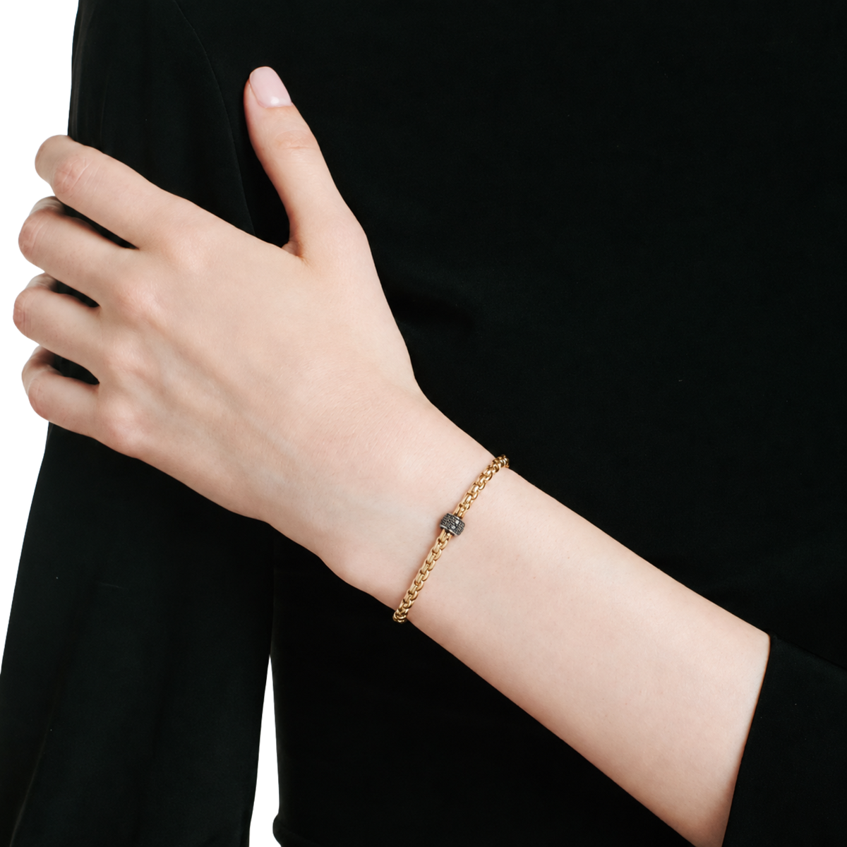 FOPE EKA black diamond rondel in 18ct yellow gold on model.