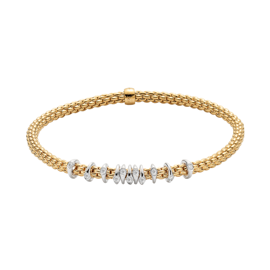 The slim Prima collection is beautifully showcased in this medium Flex'it bracelet, combining polished 18ct yellow gold with diamond-set white gold rondels.