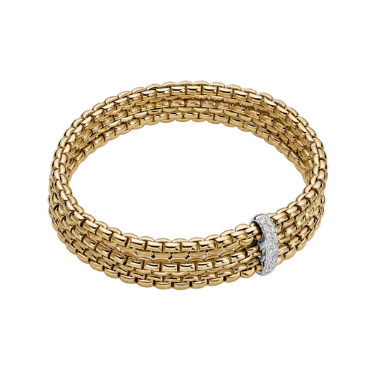 A polished white gold rondel set with 0.22ct of brilliant-cut diamonds brings elegant sparkle to this large FOPE Eka bracelet in 18ct yellow gold.
