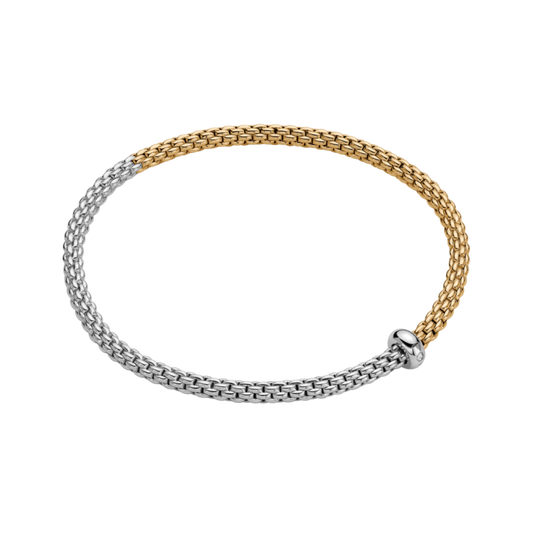 Crafted from 18ct white and yellow gold, this medium FOPE Prima bracelet showcases an elegant bicolour finish with the effortless comfort of the signature Flex'it design.