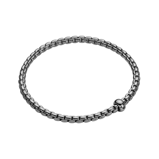 Finished with a contemporary black rhodium coating, this large FOPE Eka bracelet is crafted in 18ct white gold and accented by a single black diamond.
