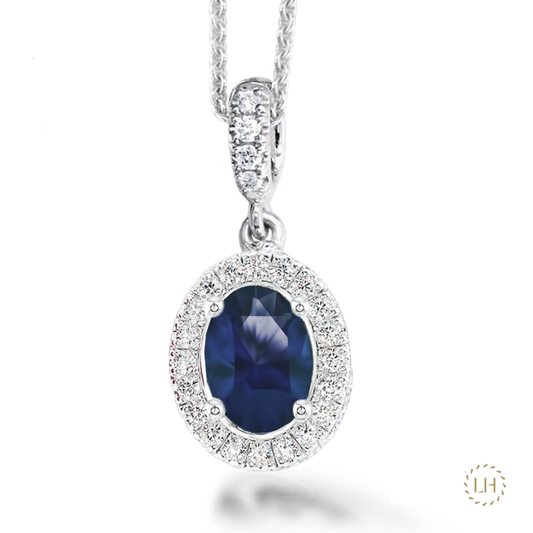 Platinum Fancy Oval Cut Sapphire & Diamond Pendant, featuring a 3.13ct sapphire surrounded by 0.24ct of sparkling diamonds.
