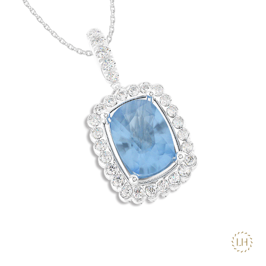 Platinum Cushion Cut Aquamarine & Diamond Pendant, featuring a 2.69ct aquamarine surrounded by 0.36ct of sparkling diamonds.