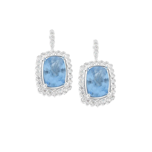 Discover these Platinum Aquamarine & Diamond Drop Earrings, featuring 3.89ct of cushion-cut aquamarines surrounded by 0.55ct of sparkling diamonds.