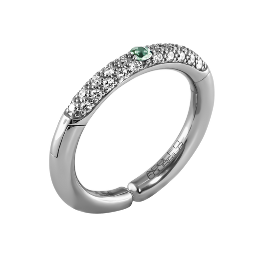 From the Populse Aqua Collection, this 18ct white gold ring features 0.29ct of brilliant diamonds and a vibrant 0.08ct green sapphire.