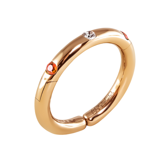 Crafted in 18ct yellow gold, this Populse Hermès ring features a 0.08ct brilliant round diamond, complemented by two 0.14ct orange sapphires set elegantly within the band.