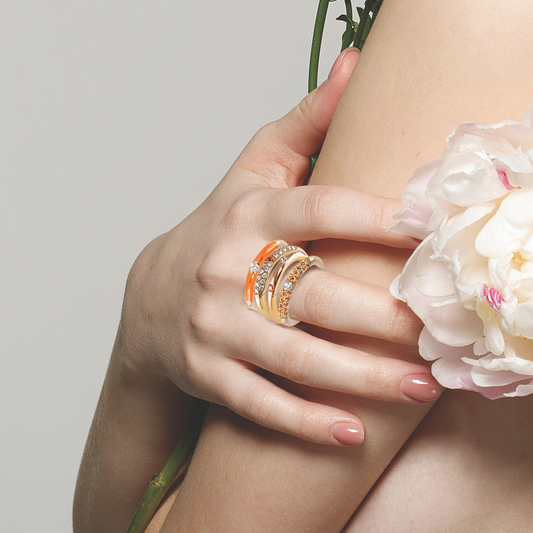 The orange sapphires complimented by a matching orange enamel creates a unique, fun pop of colour making the most unique statement piece.