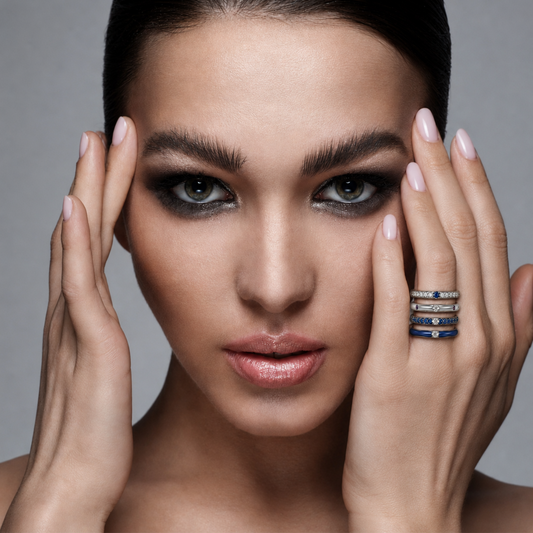 Elegant 18ct white gold stack featuring blue sapphire and blue enamel rings from the Populse Jeans Collection.