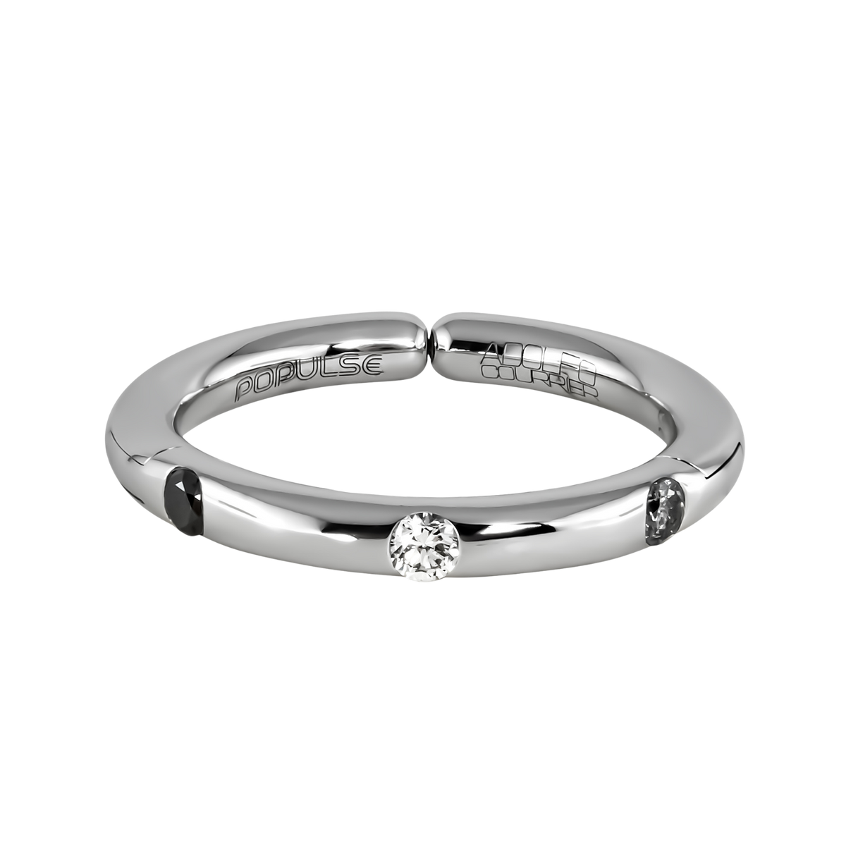 From the Populse Jungle Black & White Collection, this 18ct white gold ring pairs a brilliant round centre diamond with two black and grey diamond accents, creating a balanced design with each stone seamlessly set into the band.