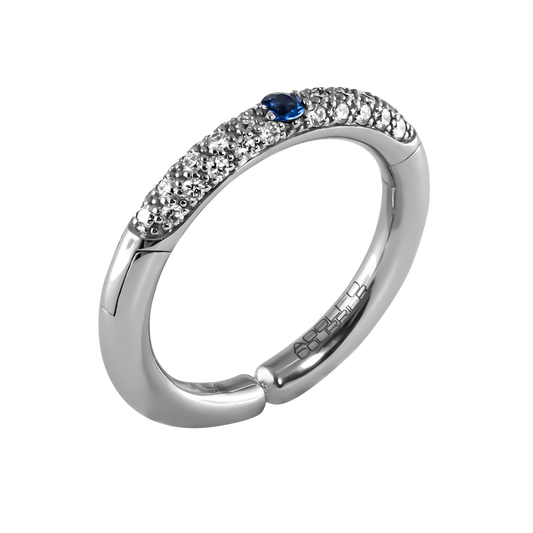 A fresh take on classic elegance, this 18ct white gold Populse Jeans ring features 0.29ct of brilliant round diamonds, beautifully highlighted by a 0.08ct blue sapphire.