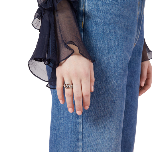 A classic Gucci sterling silver ring featuring the signature GG Marmont logo and open band design. Simple, stylish and easy to stack.