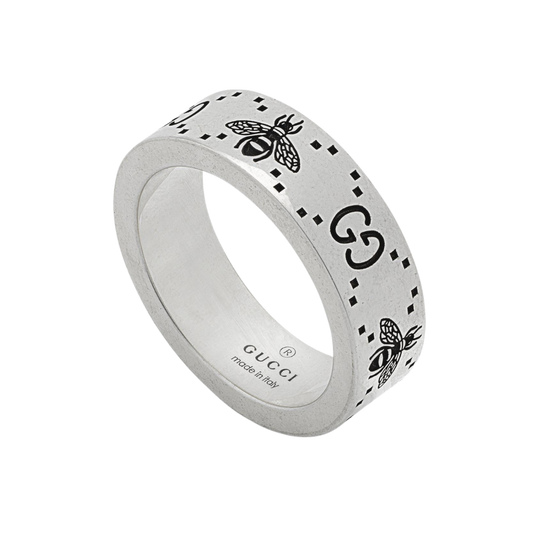 Crafted in sterling silver, this Gucci ring features the iconic GG logo and signature bee motif engraved across a sleek contemporary band. 
