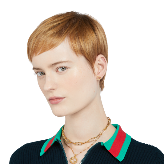 These Gucci stud earrings showcase the brand’s signature interlocking GG motif in radiant 18ct yellow gold. Designed with a polished finish and butterfly back fastening, they combine comfort with timeless style. Lightweight and versatile, they’re an elegant choice for daily wear or understated evening styling.