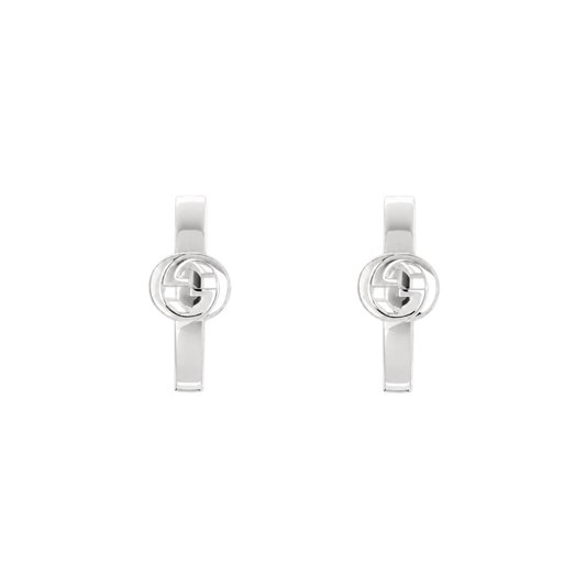 These Gucci sterling silver hoop earrings showcase the brand’s iconic Interlocking G emblem in a sleek, minimalist design. 