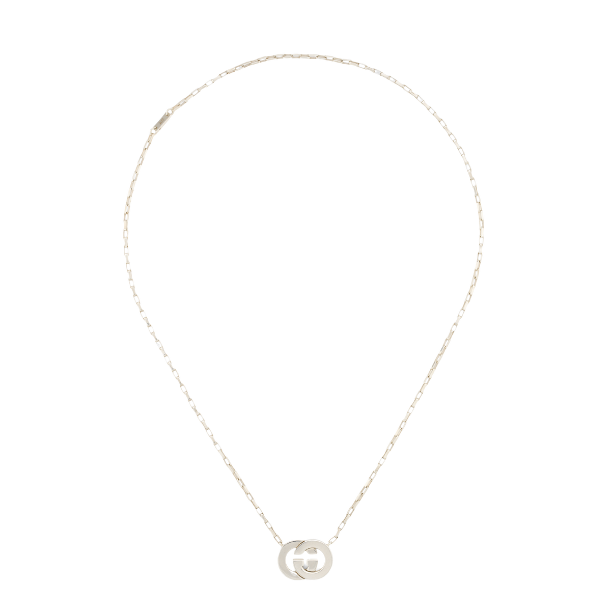 Refined and effortlessly modern, this Gucci Interlocking pendant necklace features the iconic GG logo in polished sterling silver. Designed with a clean contemporary silhouette, it’s the perfect luxury accessory for everyday styling and layered looks.