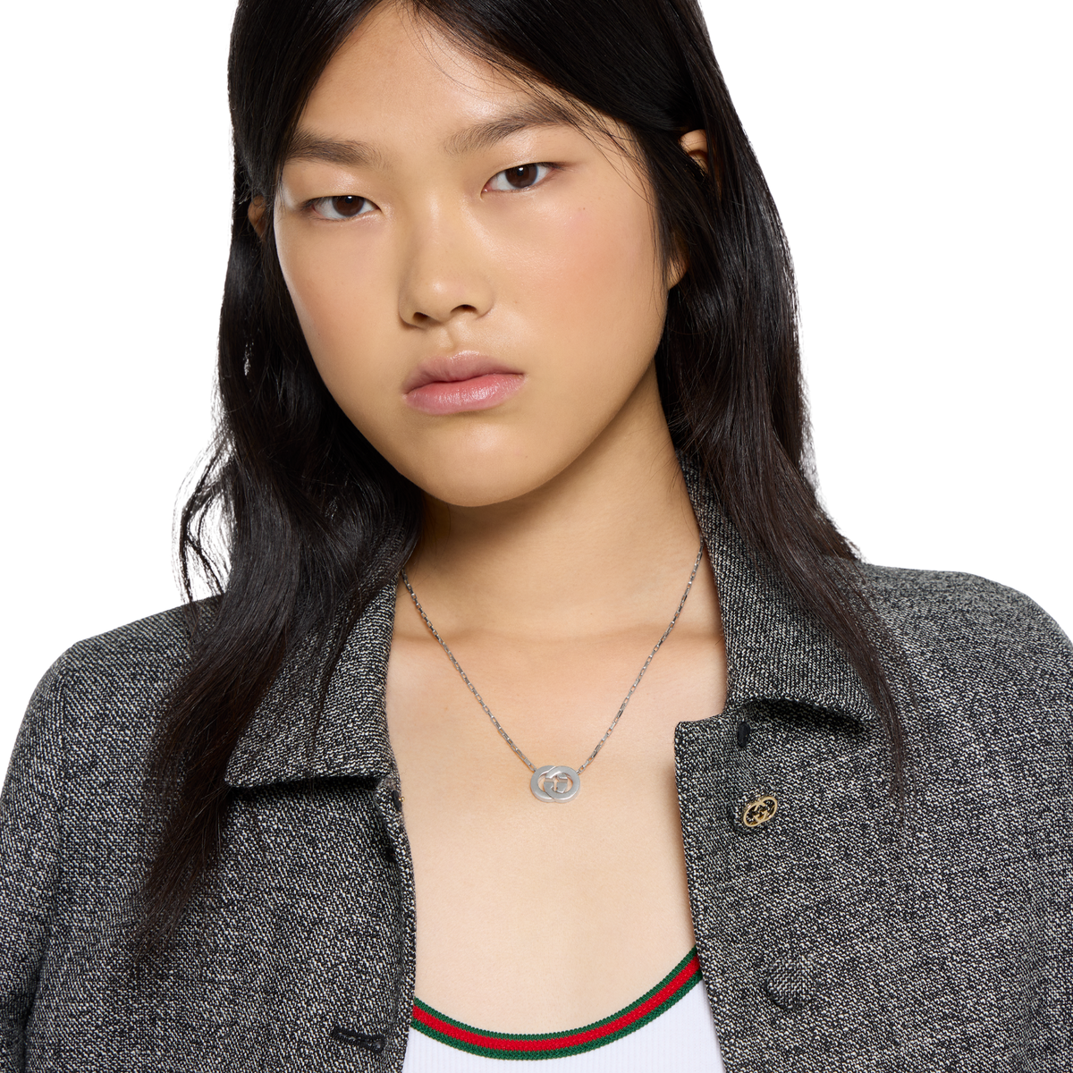 Crafted in Italy from premium sterling silver, this authentic Gucci necklace showcases the signature Interlocking G pendant suspended from a sleek chain. A timeless designer piece that blends understated elegance with iconic branding.