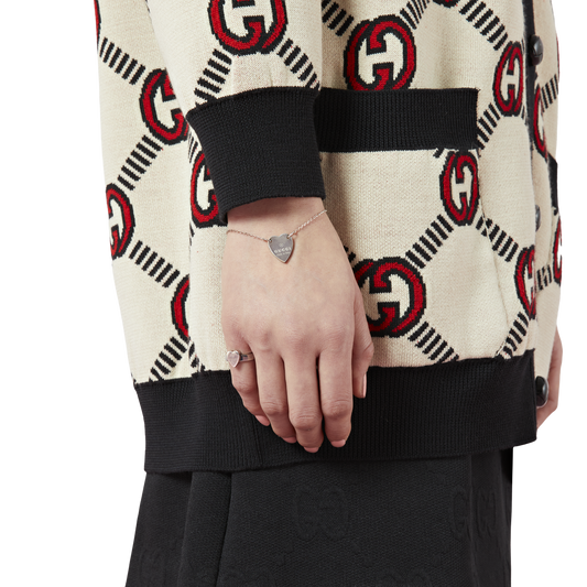 Gucci sterling silver ring featuring a polished heart pendant and Trademark design