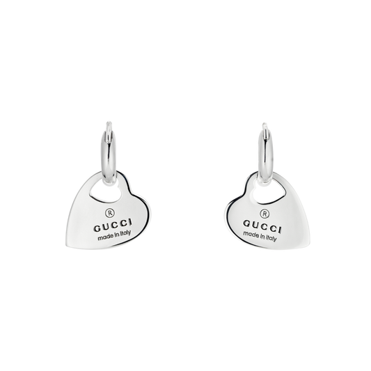  Gucci’s signature design Trademark drop earrings are crafted from polished sterling silver with Gucci engraved logo.